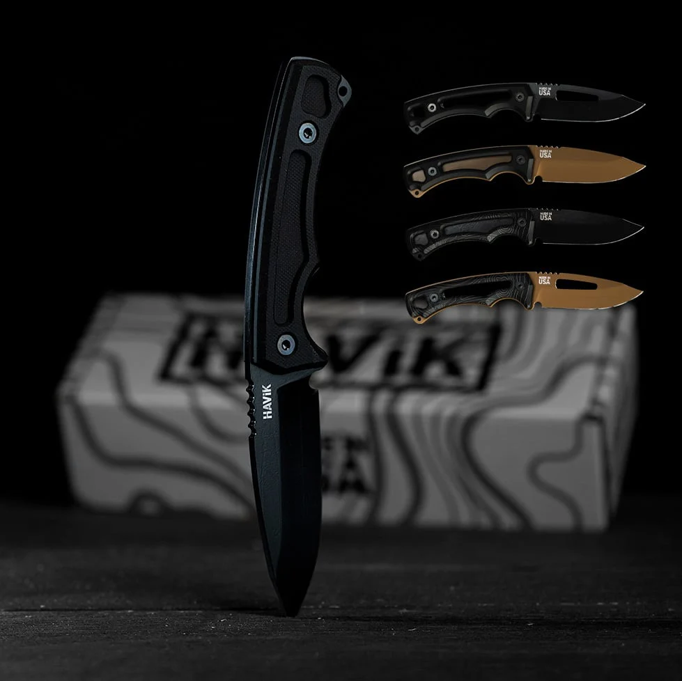 H1 Clip Point knife in black standing on its tip, with four more H1 builds and a HAViK box behind it