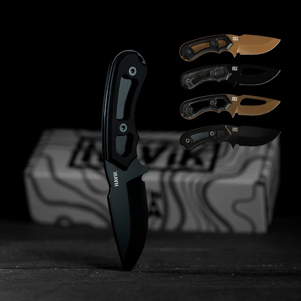 H2 Skinner knife in black standing on its tip, with four more H2 builds and a HAViK box behind it